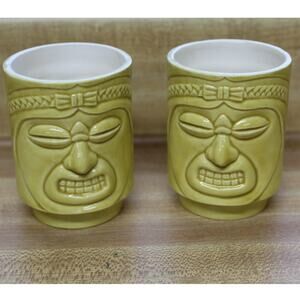 Pair Of Small Tiki Mugs. One Is Chipped